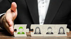 business-person-pushing-together-puzzle-blocks-with-icons-of-employees-and-a-new-employee-in-green