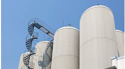 Industrial-distillating-columns-in-factory-site-with-spiral-stairs Industrial-distillating-columns-in-factory-site-with-spiral-stairs