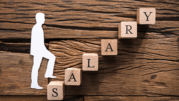 1663606673733 Closeupofpaperbusinessmanclimbingsalaryblockladderonwood