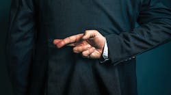 Image of business person from behind with their fingers crossed behind their back