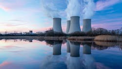 Image of nuclear power station and its reflection in water Image of nuclear power station and its reflection in water