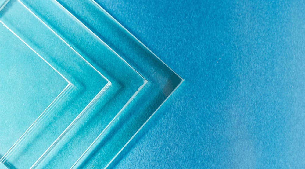 four pieces of square glass on a blue background