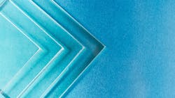 four pieces of square glass on a blue background four pieces of square glass on a blue background