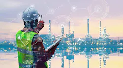 person with a hardhat on walkie talkie with computer generated overlay representing wireless network