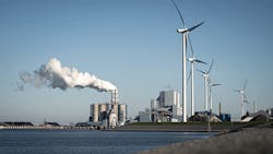 image of factory surrounded by windmills image of factory surrounded by windmills
