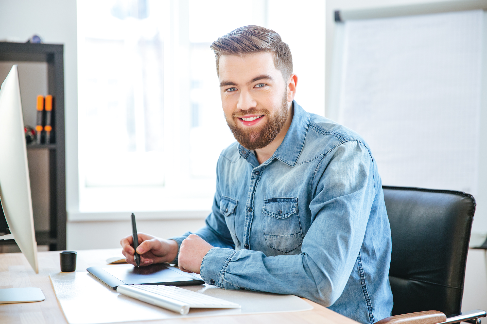 male engineer sitting at computer desk