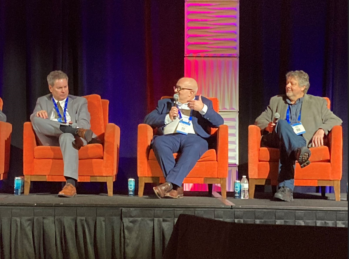 Sandwiched between the worlds of OT and IT, Gabriel Gonzalez-Alonso of ZF Group (center) makes a point to Allen Pertuit of Shell (left) and Collin Masson of Microsoft (right) during the general session&rsquo;s panel discussion on Feb. 7 at ARC Industry Leadership Forum 2023 in Orlando.
