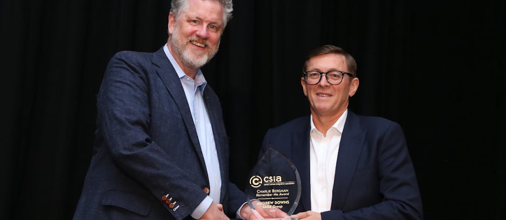 Wright Sullivan (l.), president of A&amp;E Engineering Inc., and emcee of the 2023 CSIA awards dinner, presents the Charlie Bergman &ldquo;Remember Me&rdquo; award to Andrew Downs (r.), founder and executive director of Sage Group.