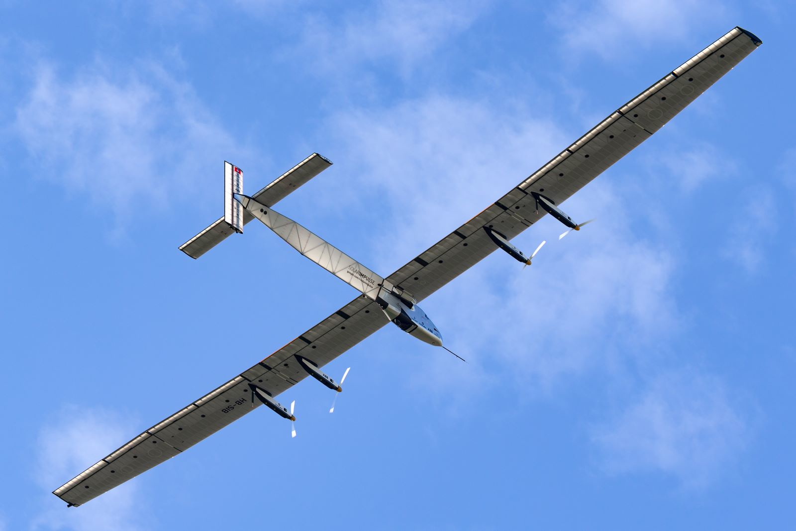 Bertrand Piccard&rsquo;s Solar Impulse 2 solar-powered aircraft soars through the sky over Switzerland. (Source: Shutterstock)