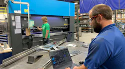 Dave Smit, senior systems analyst at Interstates (right), examines the network traffic dashboard and communication settings in Veracity OT Network Controller software at the system integrator’s prefabrication shop in Sioux Center, Iowa, while Jace Mulder, production technician (left), operates the Haco press break. OT Network Controller manages a software-defined network (SDN) switch from Dynics, and uses zero-trust and deny-by-default methods, which enables Interstates to improve network visibility and security for the machine and enhance operational efficiency. Source: Interstates