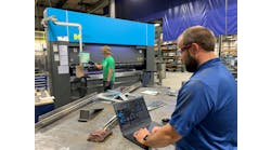 Dave Smit, senior systems analyst at Interstates (right), examines the network traffic dashboard and communication settings in Veracity OT Network Controller software at the system integrator’s prefabrication shop in Sioux Center, Iowa, while Jace Mulder, production technician (left), operates the Haco press break. OT Network Controller manages a software-defined network (SDN) switch from Dynics, and uses zero-trust and deny-by-default methods, which enables Interstates to improve network visibility and security for the machine and enhance operational efficiency. Source: Interstates Dave Smit, senior systems analyst at Interstates (right), examines the network traffic dashboard and communication settings in Veracity OT Network Controller software at the system integrator’s prefabrication shop in Sioux Center, Iowa, while Jace Mulder, production technician (left), operates the Haco press break. OT Network Controller manages a software-defined network (SDN) switch from Dynics, and uses zero-trust and deny-by-default methods, which enables Interstates to improve network visibility and security for the machine and enhance operational efficiency. Source: Interstates