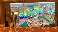 Greg Demchak, senior director of the Innovation Lab (iLab) at Bentley, shows how its software and visualization algorithms integrate multiple public data sources, turn 2D maps into 3D representations, add Google Maps tiles to show energy use, and include sensor data for water pressure to show resources used by many of the buildings in downtown Singapore.