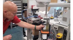 In system integrator Arthur G. Russell’s R&D and mock-up area in Bristol, Conn., senior R&D engineer Jerry Buchas adjusts a robot-actuated loader that brings a client’s product to the proper location in a case, so its end-of-arm tooling (EOT) with an attached actuator can push the product into place. AGR helps customers develop, test, and derisk their designs and requirements for new end-products and production systems. Its clients want to derisk because shorter product lifecycles and increasing demand for variety are compressing development and commissioning schedules. In system integrator Arthur G. Russell’s R&D and mock-up area in Bristol, Conn., senior R&D engineer Jerry Buchas adjusts a robot-actuated loader that brings a client’s product to the proper location in a case, so its end-of-arm tooling (EOT) with an attached actuator can push the product into place. AGR helps customers develop, test, and derisk their designs and requirements for new end-products and production systems. Its clients want to derisk because shorter product lifecycles and increasing demand for variety are compressing development and commissioning schedules.