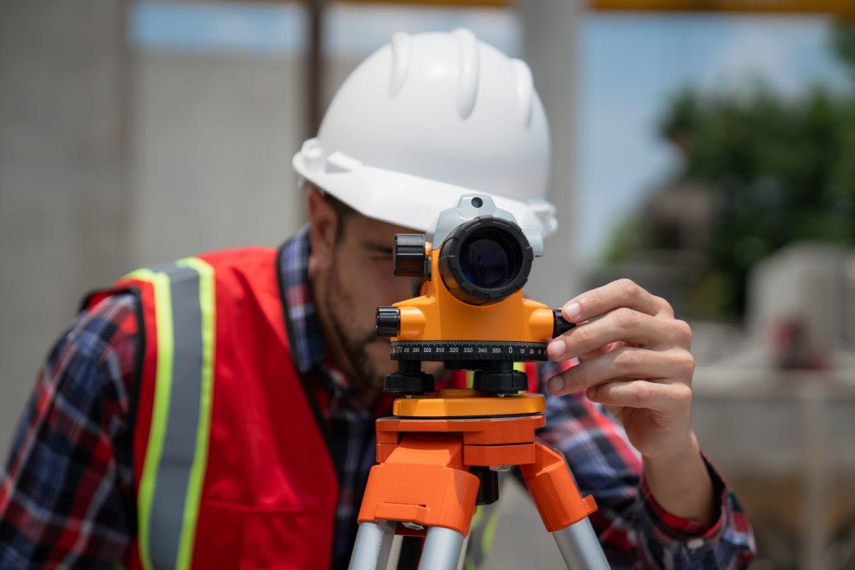 Civil or construction engineer using a survey camera