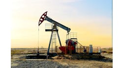 Crude oil pump jack at oilfield on sunset background Crude oil pump jack at oilfield on sunset background