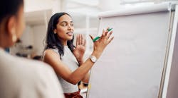 Woman, mentor and whiteboard in office for training, teaching and learning for skill or career development Woman, mentor and whiteboard in office for training, teaching and learning for skill or career development