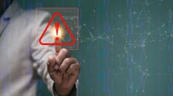 Businessman pointing to triangle caution warning sign for notification error and maintenance concept Businessman pointing to triangle caution warning sign for notification error and maintenance concept