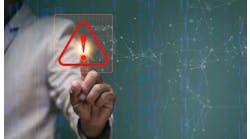 Businessman pointing to triangle caution warning sign for notification error and maintenance concept Businessman pointing to triangle caution warning sign for notification error and maintenance concept