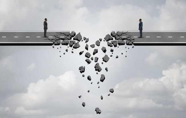 two businessmen on a road bridge that is breaking down and disconnecting