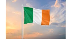 Ireland flag waving on sundown sky Ireland flag waving on sundown sky