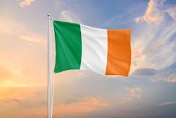 Ireland flag waving on sundown sky Ireland flag waving on sundown sky
