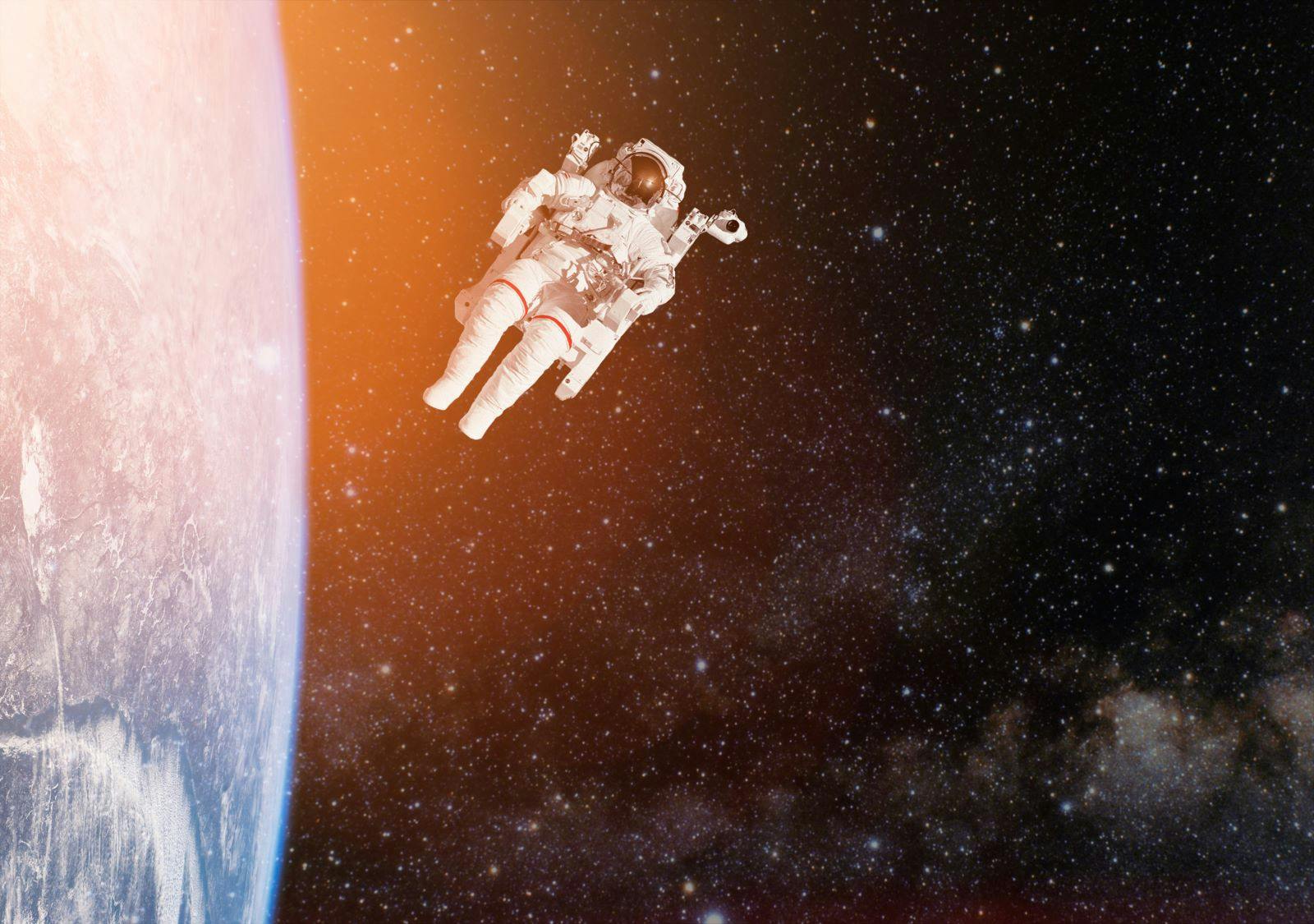 Astronaut spaceman aerial space stars Earth. Elements of this image furnished by NASA.