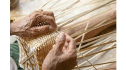 Senior man hands manually weaving bamboo. Senior man hands manually weaving bamboo.