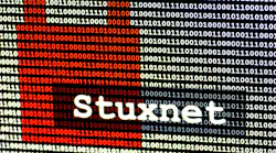 The name of the computer virus Stuxnet in front of a binary background