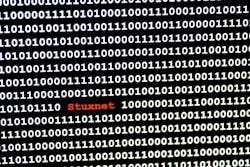 The name of the computer virus Stuxnet in front of a binary background The name of the computer virus Stuxnet in front of a binary background