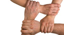 Four interlocking hands Four interlocking hands