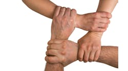 Four interlocking hands Four interlocking hands