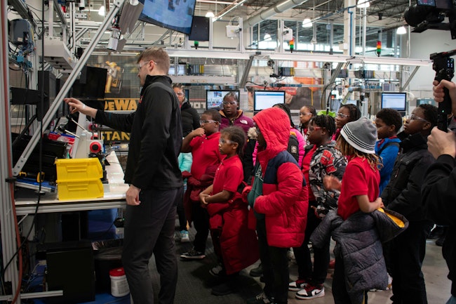 Figure 1: Steady streams of students and other visitors take in the digital and cybersecurity demonstrations at Manufacturing times Digital (MxD) institute, which provides participants with programs in digitalized tools, cybersecurity and workforce expertise.