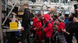 Figure 1: Steady streams of students and other visitors take in the digital and cybersecurity demonstrations at Manufacturing times Digital (MxD) institute, which provides participants with programs in digitalized tools, cybersecurity and workforce expertise. Figure 1: Steady streams of students and other visitors take in the digital and cybersecurity demonstrations at Manufacturing times Digital (MxD) institute, which provides participants with programs in digitalized tools, cybersecurity and workforce expertise.