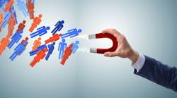 Businessman in recruitment concept with horseshoe magnet Businessman in recruitment concept with horseshoe magnet