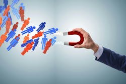 Businessman in recruitment concept with horseshoe magnet Businessman in recruitment concept with horseshoe magnet