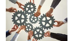 Hands from diverse individuals work together to arrange large gears on a surface, symbolizing cooperation and collective effort for success in a business environment. Hands from diverse individuals work together to arrange large gears on a surface, symbolizing cooperation and collective effort for success in a business environment.