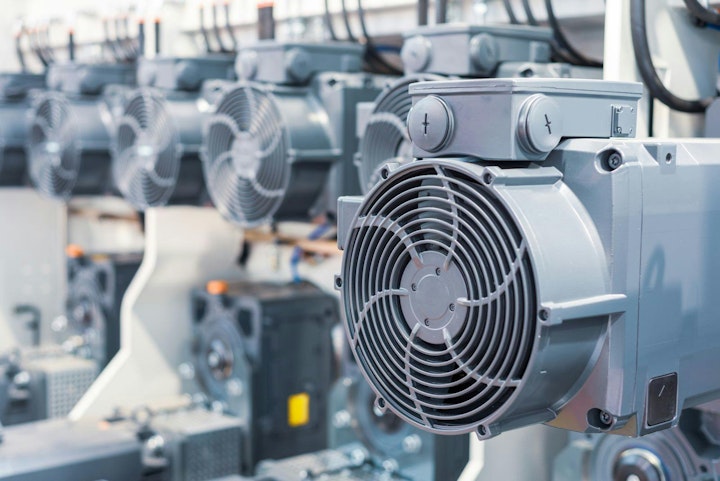 A group of powerful electric motors. Electric drive of industrial equipment. Abstract industrial background.