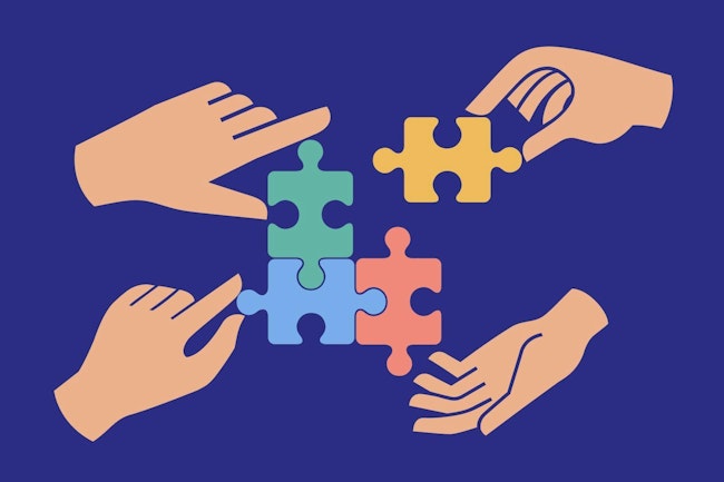 Four hands assembling colorful puzzle pieces together. Concept of teamwork, cooperation, unity, problem solving, strategy, partnership, collaboration, and creative business solution.