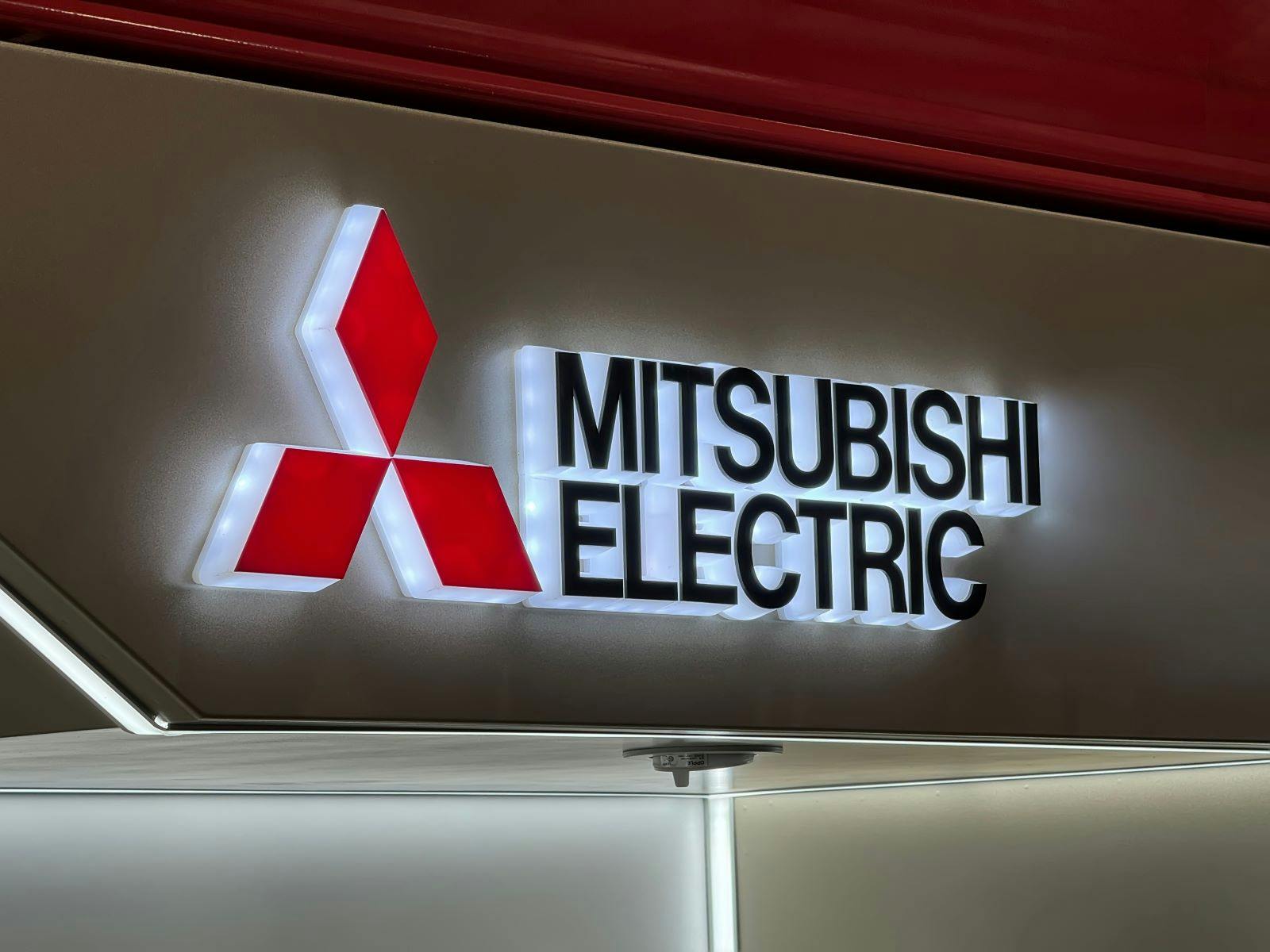 Mitsubishi Electric Corporation brand logo on a store sign.