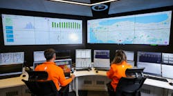 Engineers at Senkron Digital looking at charts on a screen Engineers at Senkron Digital looking at charts on a screen