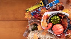 Happy Thanksgiving with construction tools, maple leaves and pumpkin on wood background. Autumn composition with copy space. Plumber Thanksgiving. Top view. Happy Thanksgiving with construction tools, maple leaves and pumpkin on wood background. Autumn composition with copy space. Plumber Thanksgiving. Top view.