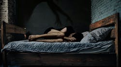 This image captures the chilling essence of sleep paralysis: a person curled in fear, with a shadowy hand looming overhead, symbolizing the helplessness and terror of the experience. This image captures the chilling essence of sleep paralysis: a person curled in fear, with a shadowy hand looming overhead, symbolizing the helplessness and terror of the experience.