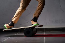 oval wooden deck for balance board. solid plastic roller for balance board. Rocker-roller boards. Isolated oval wooden deck for balance board. solid plastic roller for balance board. Rocker-roller boards. Isolated