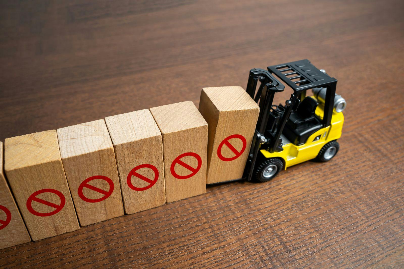 A forklift erects a restrictive barrier. Create a new restriction. Provide new sanctions and restrictions. Laws and regulations. Bans and taboo. Stop work, freeze and cancel. Block VPN services.