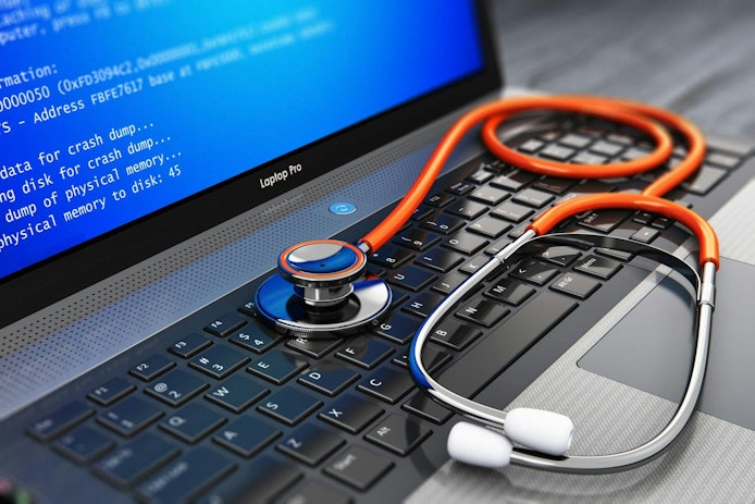 Computer bug, virus and service, repair and maintenance technology concept: 3D render of business laptop or notebook PC with error message on blue screen BSOD and red medical stethoscope on keyboard