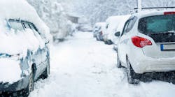 Parked car covered with snow during snow storm Parked car covered with snow during snow storm