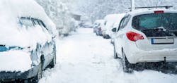 Parked car covered with snow during snow storm Parked car covered with snow during snow storm