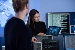 Cybersecurity team working in a Cyber Security Operations Center to protect systems and technologies Cybersecurity team working in a Cyber Security Operations Center to protect systems and technologies