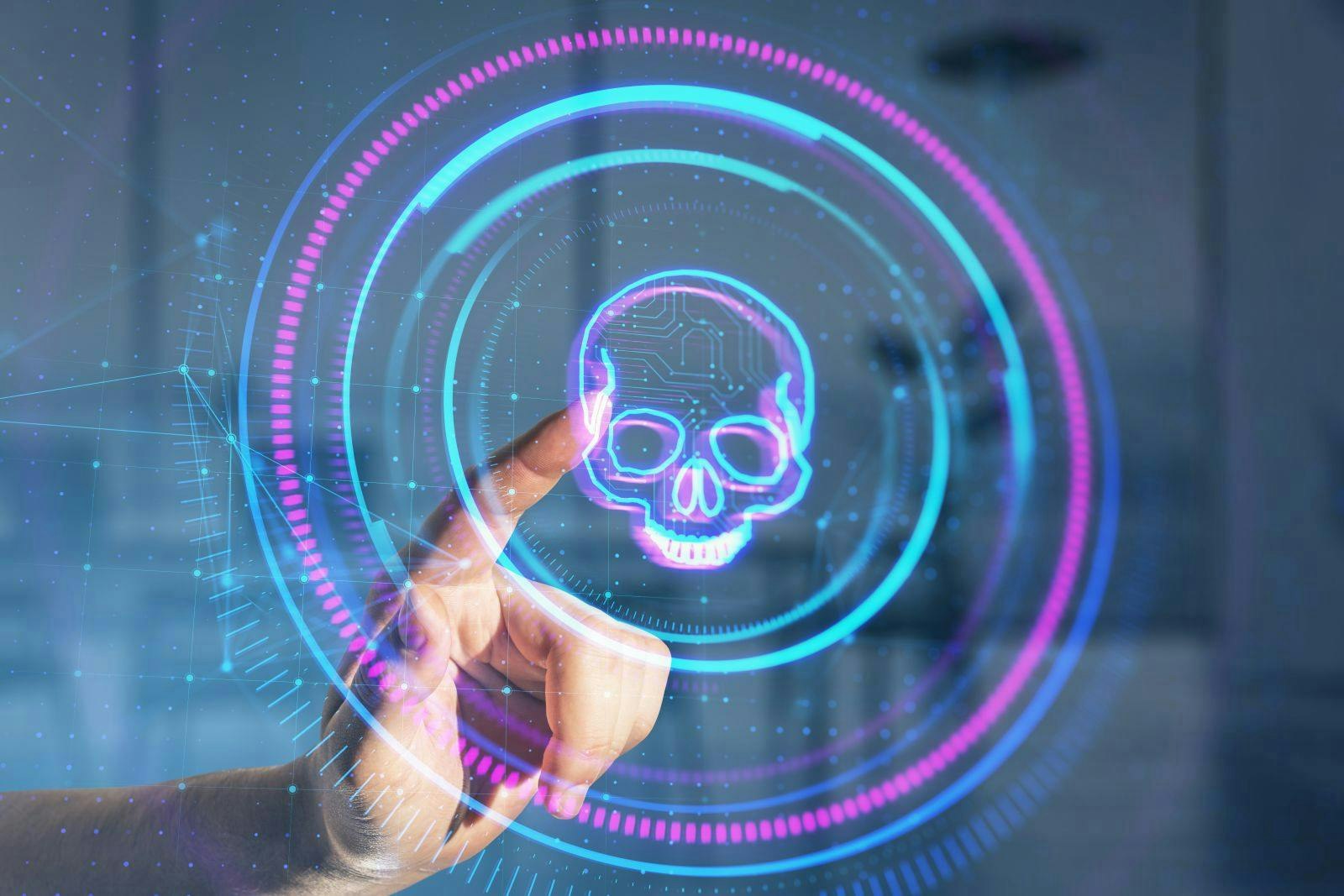 Close up of male hand pointing at creative digital round skull hologram on blurry office interior background.