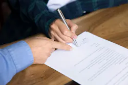 Close up, two unrecognizable businesswomen, customer and sales manager sit at desk, agent and client making commercial deal in moment of signing formal document, Close up, two unrecognizable businesswomen, customer and sales manager sit at desk, agent and client making commercial deal in moment of signing formal document,